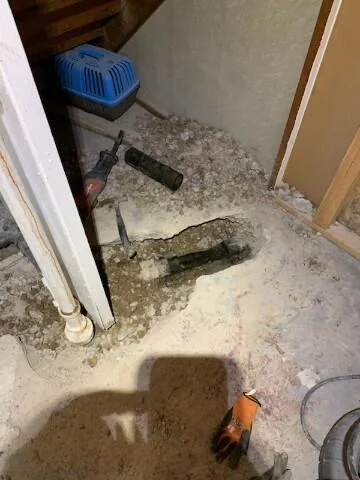 Exposed plumbing and sewer-line project reference photograph